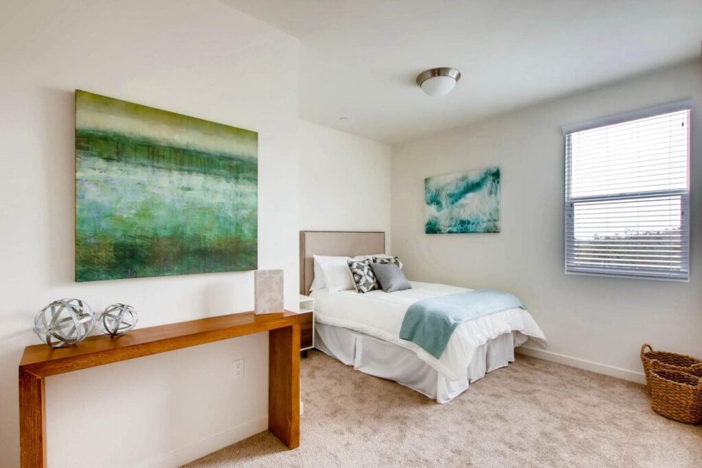 Open concept living room and kitchen at Ascent at Campus of Life apartments for rent in San Diego