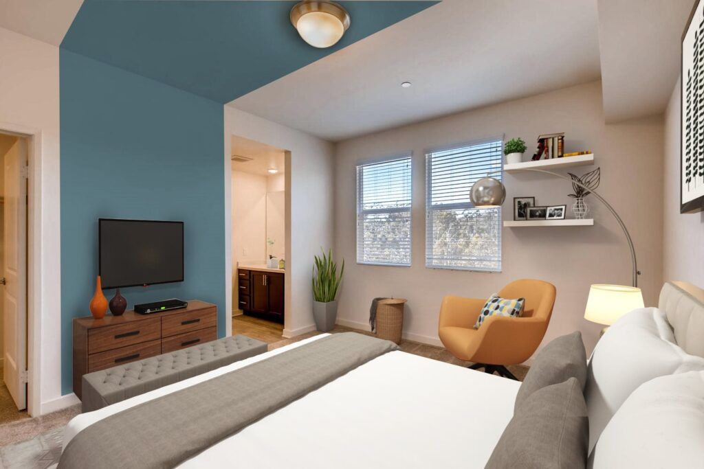 Bedroom with large windows and private bathroom