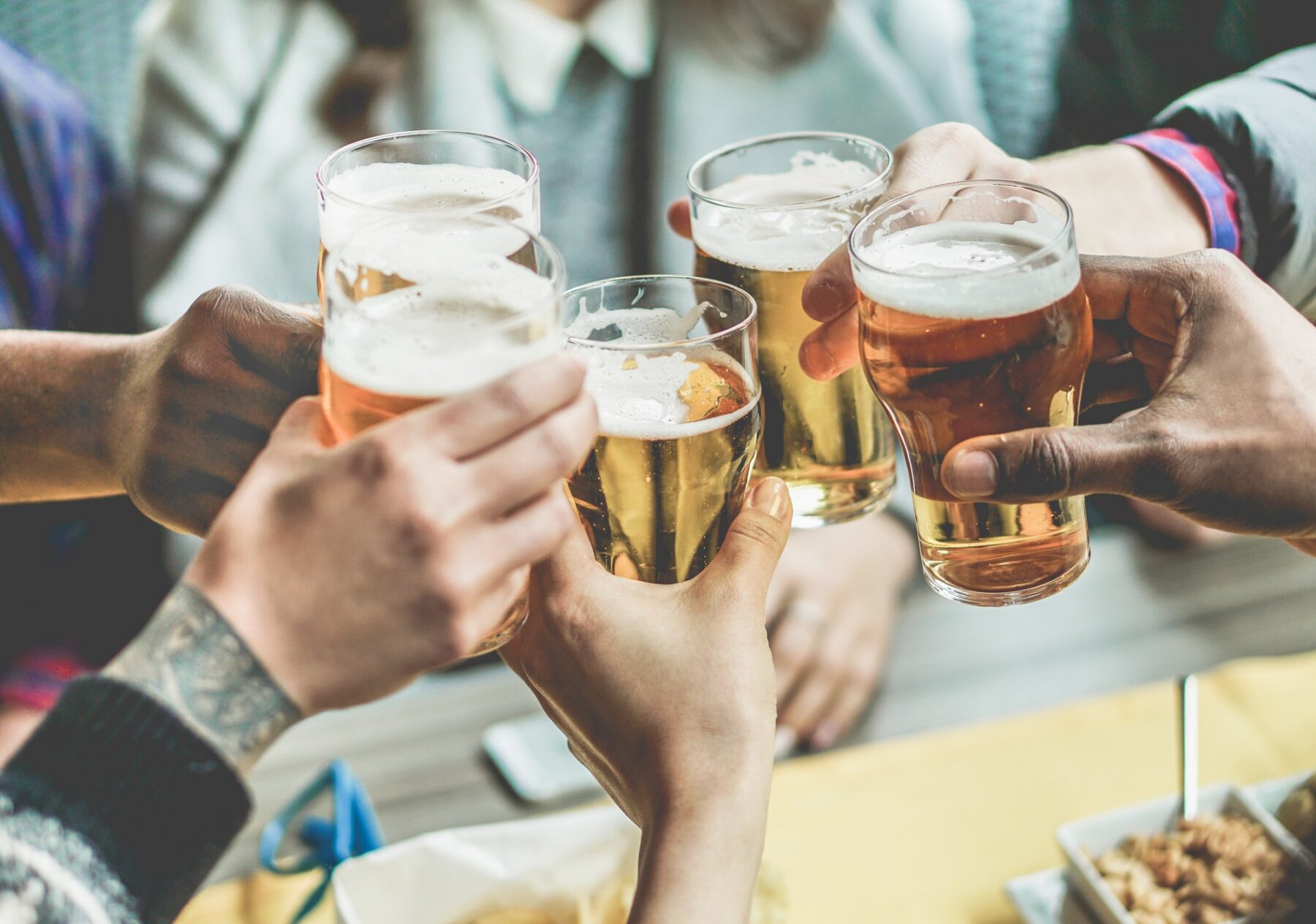 Group of people clinking glasses for a toast