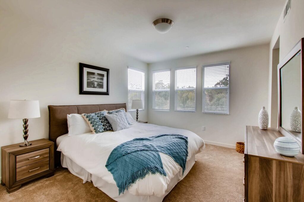 staged bedroom with multiple windows