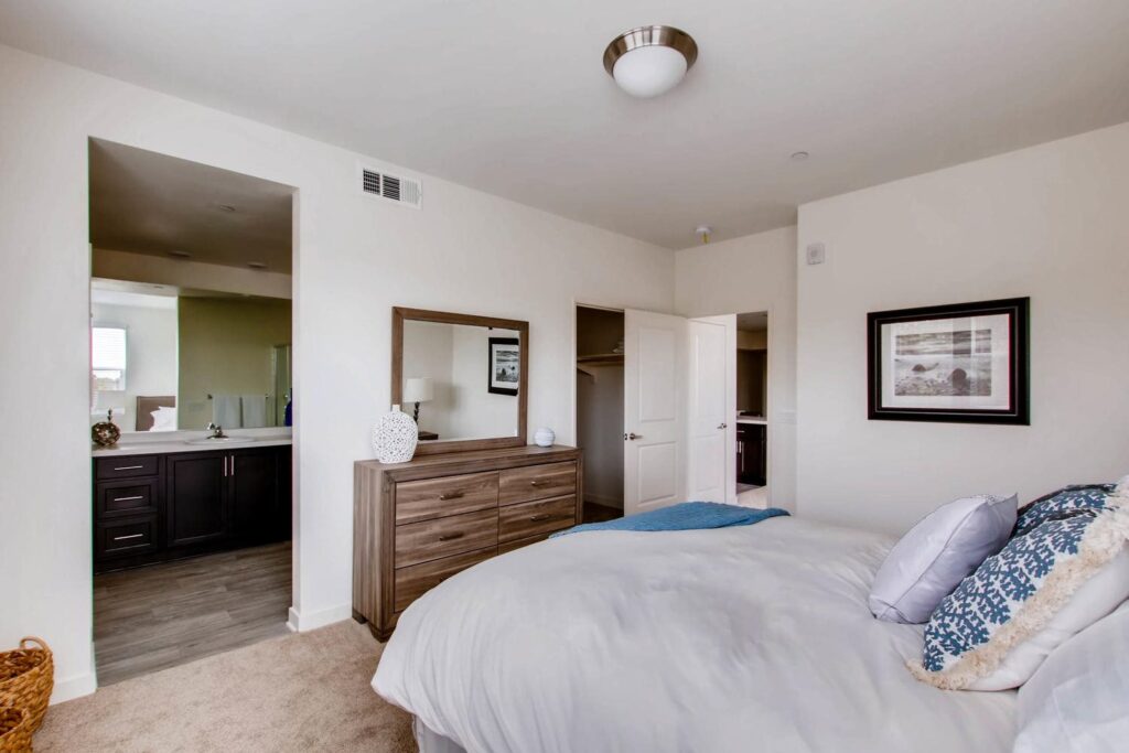 bedroom with private bath and walk in closet