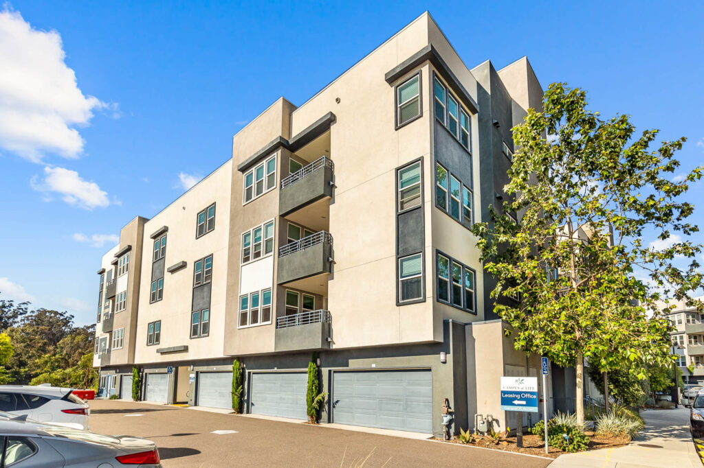 Building exterior showing garages and balconies