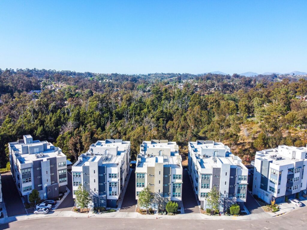 Aerial view of the property showing surrounding trees