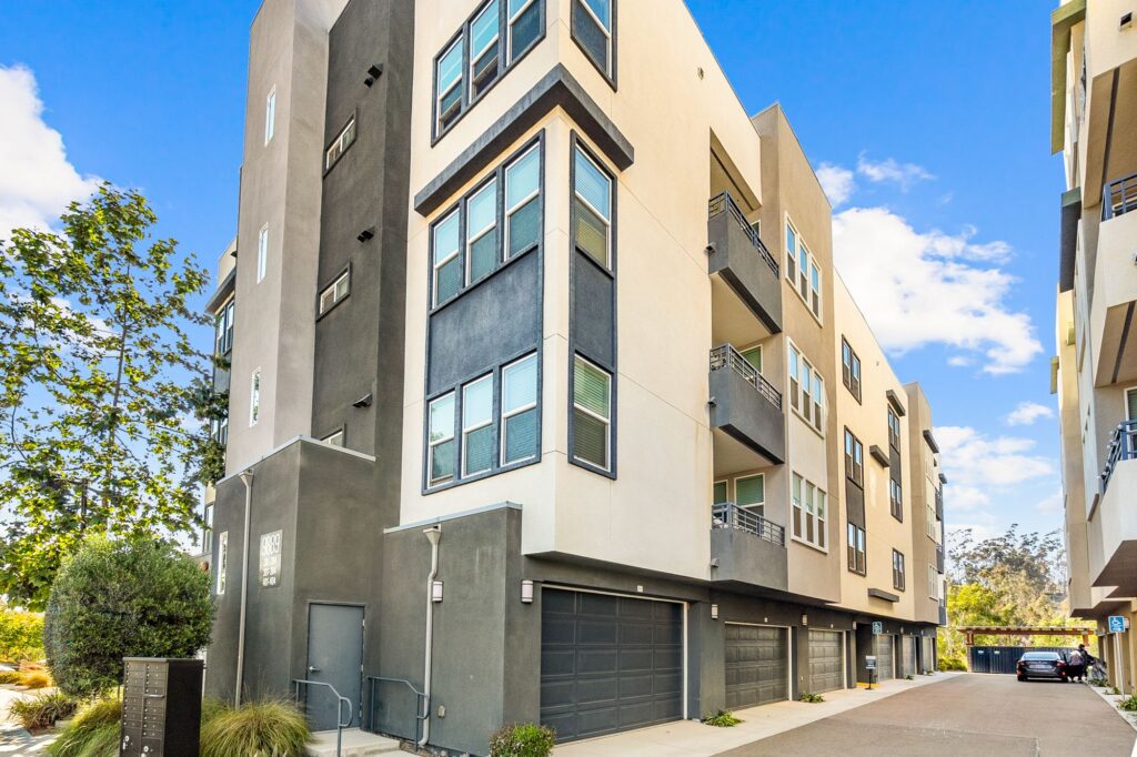 Building exterior with garages, balconies and mailboxes