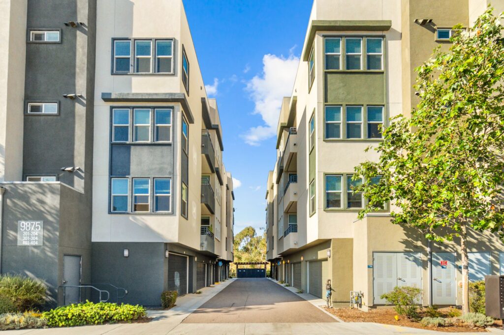Building exterior with garages and balconies