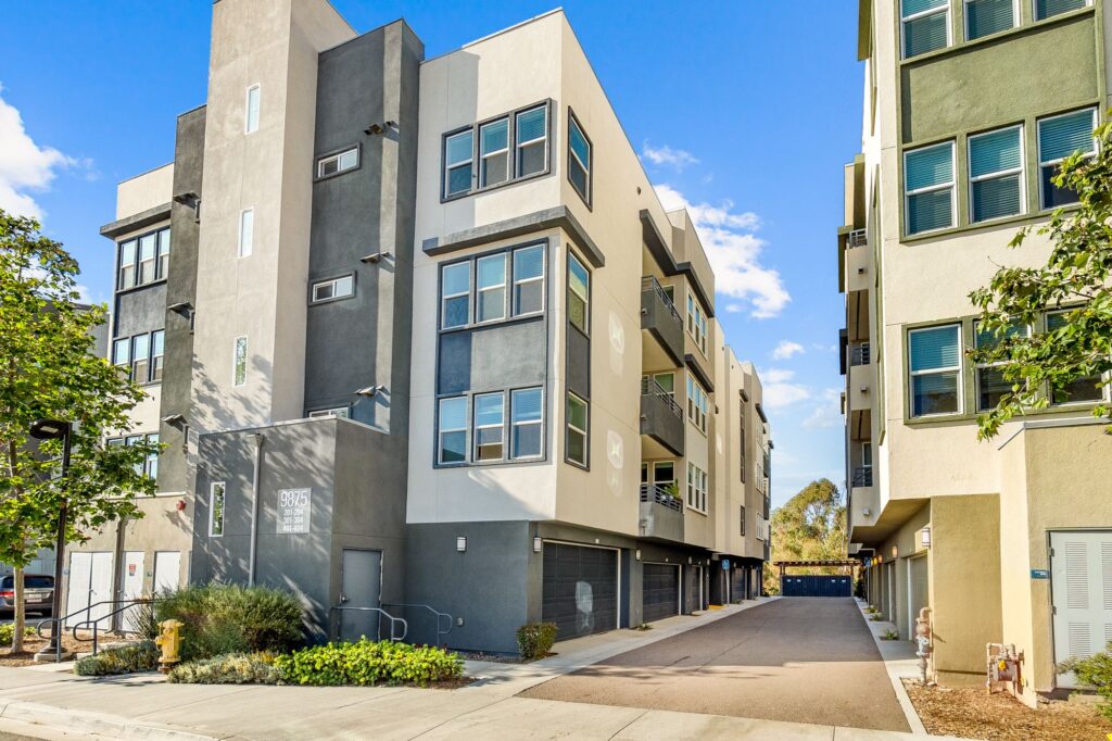 Building exterior with garages and balconies