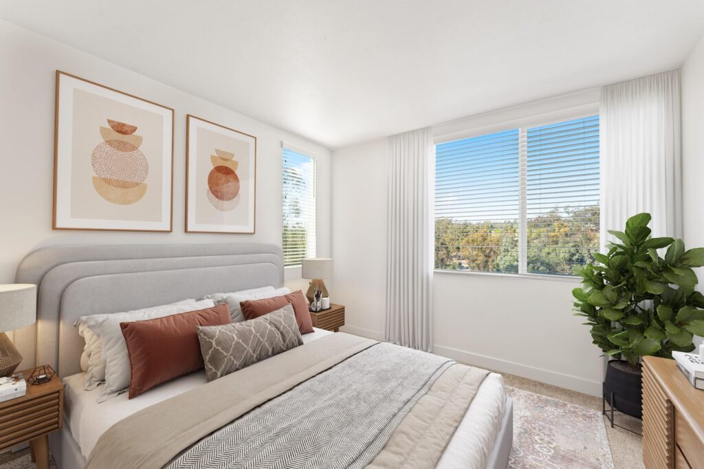 Bedroom with carpet flooring, natural lighting, wall decor, and large windows