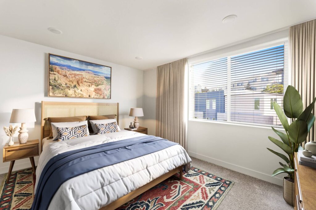 Bedroom with carpet flooring and large windows