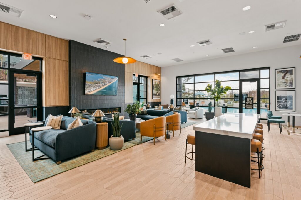 Open concept kitchen, living and dining room at Ascent at Campus of Life pet-friendly apartments in San Diego